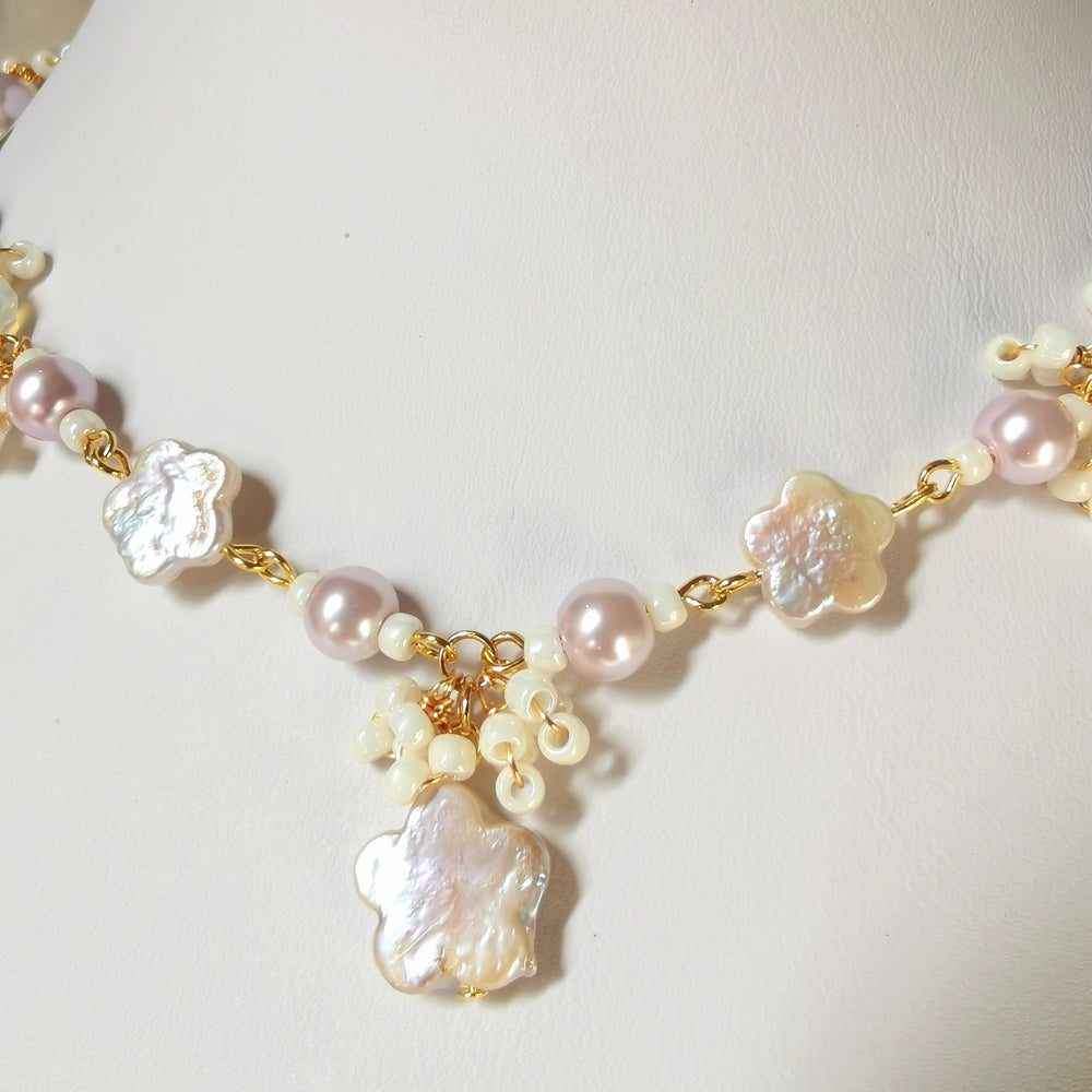 
                  
                    This Primrose Pearl Necklace is a sweet handmade pearl necklace that uses flower-shaped freshwater pearls and lovely lilac crystal pearls. Dainty seed bead details adorn the whole necklace, giving it an elegant and delicate look.
                  
                