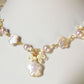 This Primrose Pearl Necklace is a sweet handmade pearl necklace that uses flower-shaped freshwater pearls and lovely lilac crystal pearls. Dainty seed bead details adorn the whole necklace, giving it an elegant and delicate look.